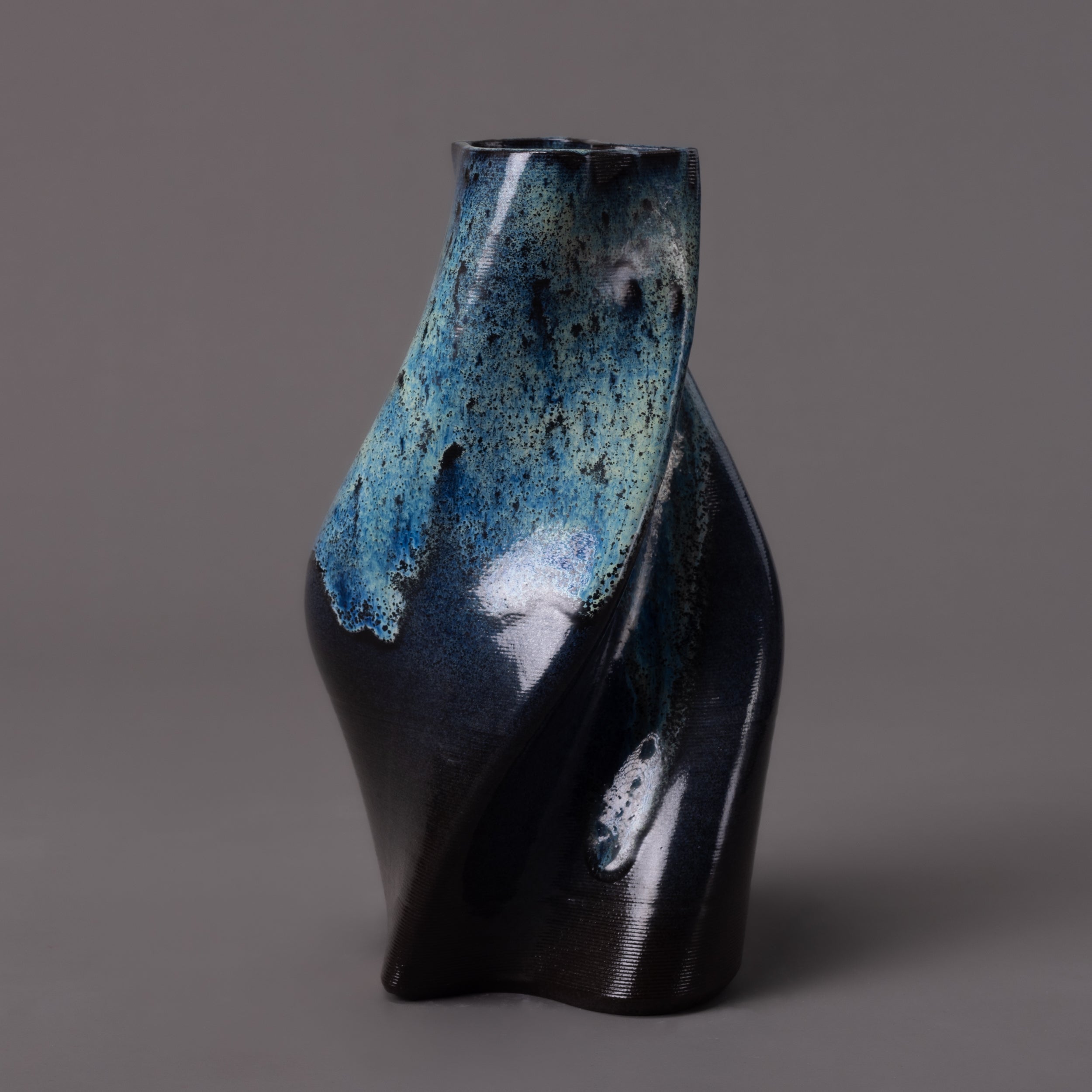 black clay, glaze effect tornado sculpture – algorithmic ceramic design