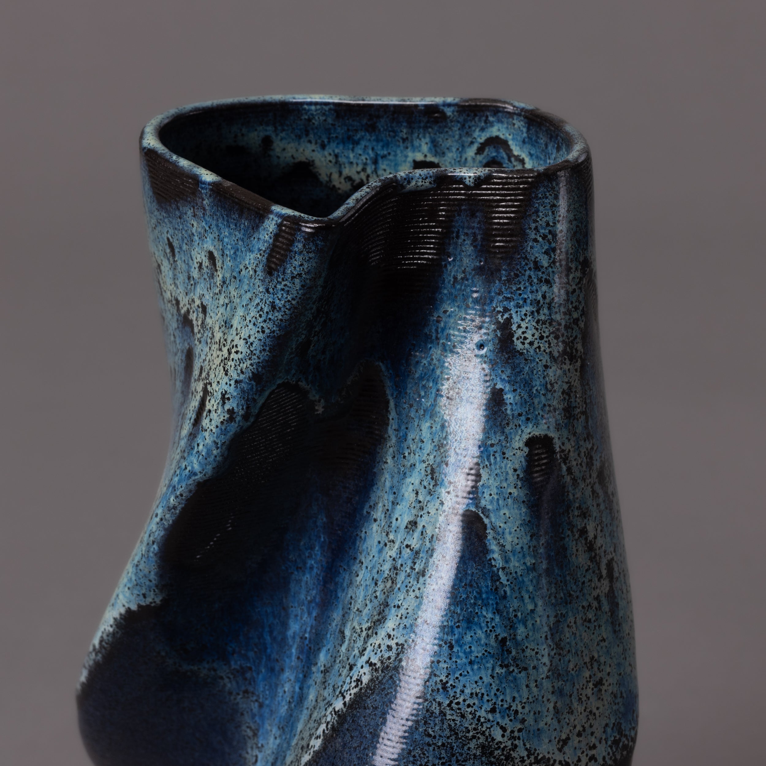 3D-printed tornado sculpture in black clay, glaze effect – BinaryCeramics