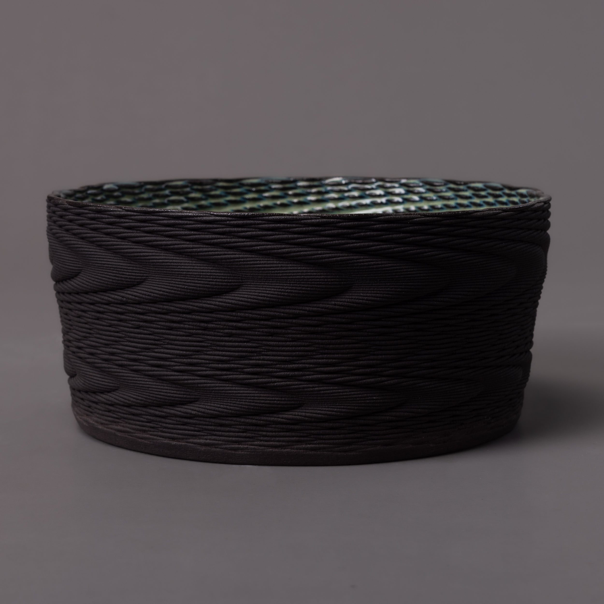 black clay, green glaze wave sculpture – algorithmic ceramic design