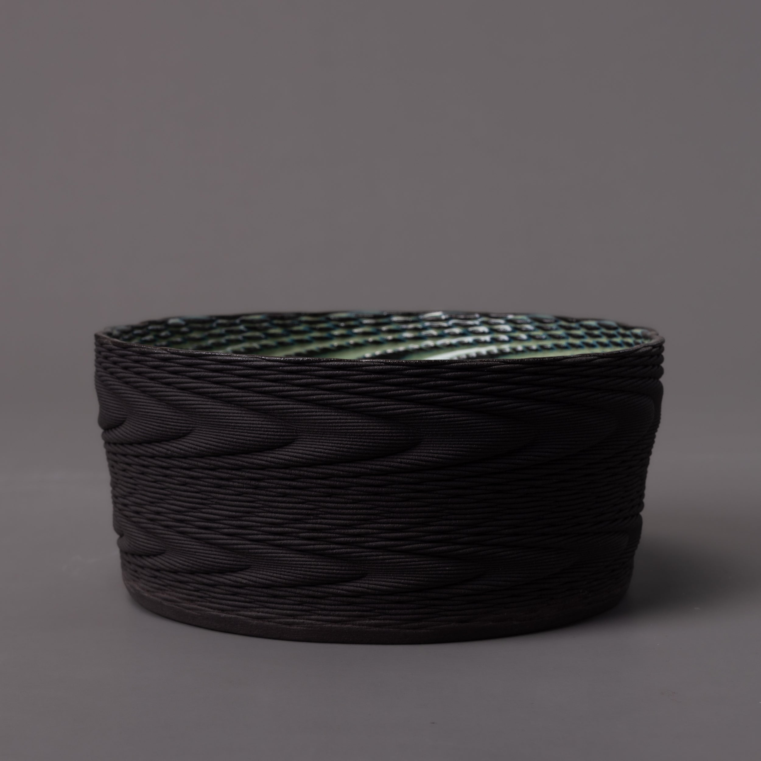 3D-printed wave sculpture in black clay, green glaze – BinaryCeramics