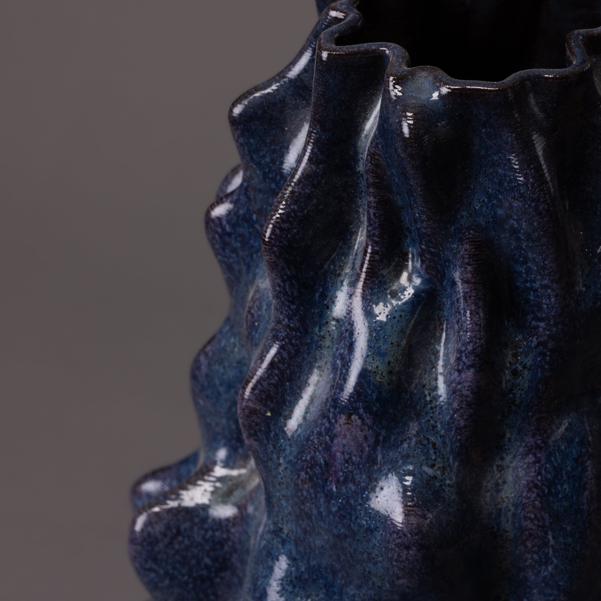 black clay, blue glaze alien sculpture – algorithmic ceramic design