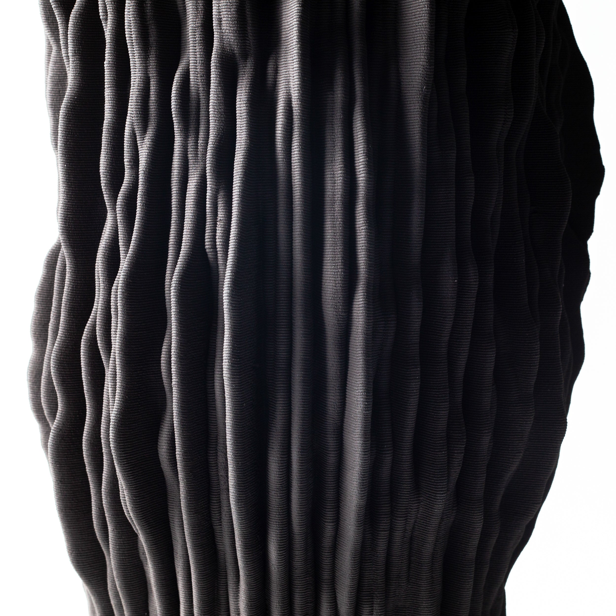Digitally fabricated ceramic piece from the Frequency collection, inspired by sound wave patterns and rhythmic surface design