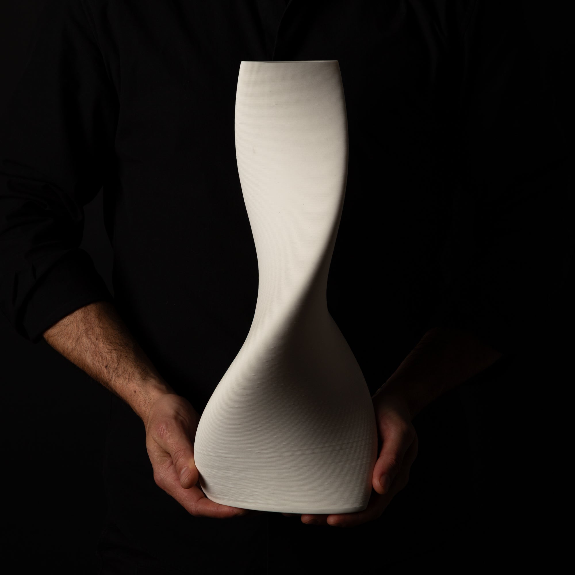 T-1001 Tornado Ceramic Sculpture – White Porcelain – artist holding – BinaryCeramics Athens