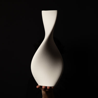 T-1001 Tornado Ceramic Sculpture – White Porcelain – artist holding side view – BinaryCeramics Athens