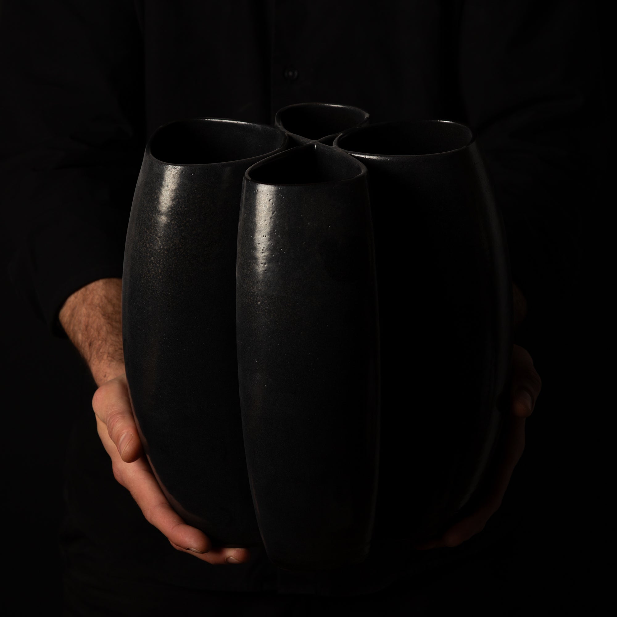 I-0010 Intersect Continuous-Line Sculpture – Black Glaze – artist holding – BinaryCeramics Athens