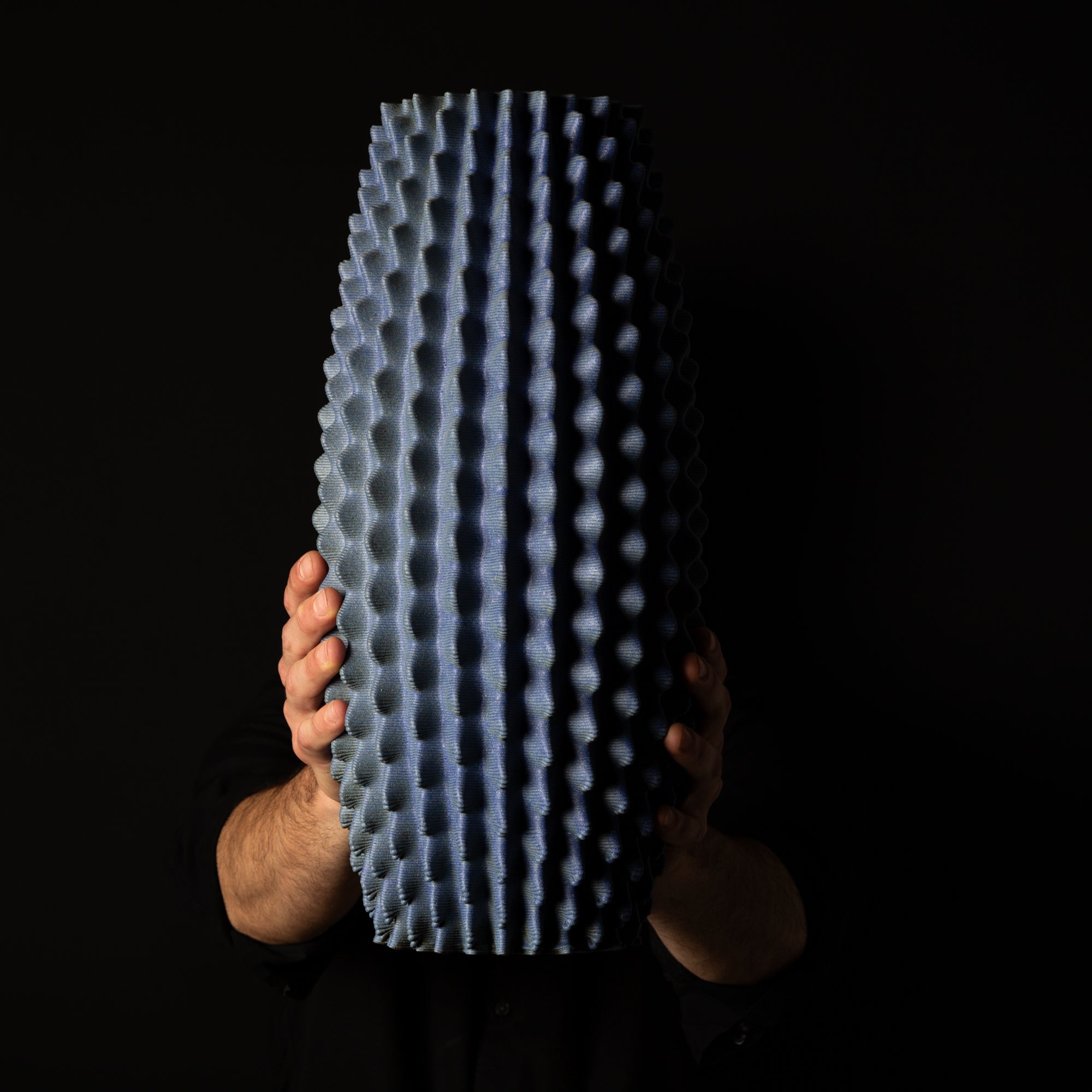 C-0001 Cactus Organic Form – Black Clay Blue Glaze – artist holding – BinaryCeramics Athens