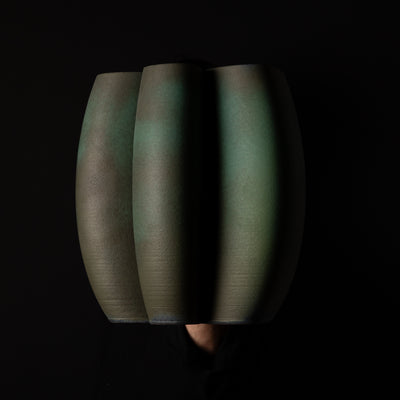 I-0010 Intersect Continuous-Line Sculpture – Green Glaze – artist holding side view – BinaryCeramics Athens