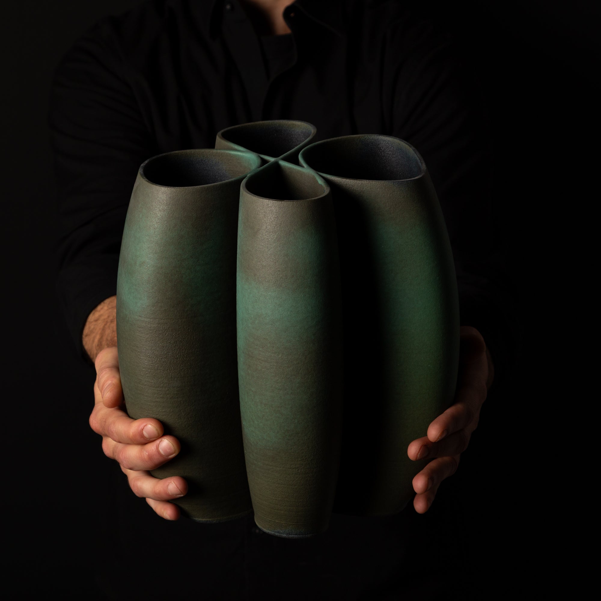 I-0010 Intersect Continuous-Line Sculpture – Green Glaze – artist holding – BinaryCeramics Athens