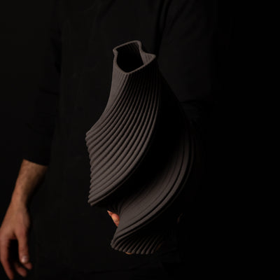 T-1000 Tornado Ceramic Form – Black Clay – artist holding side view – BinaryCeramics Athens